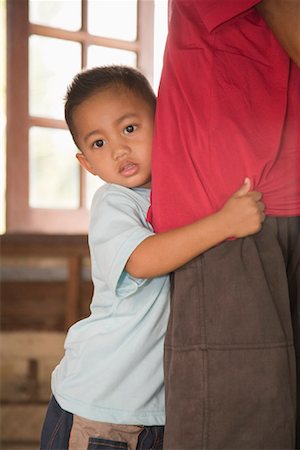 Boy Clinging to Dad's Leg Stock Photo - Rights-Managed, Code: 700-01954855