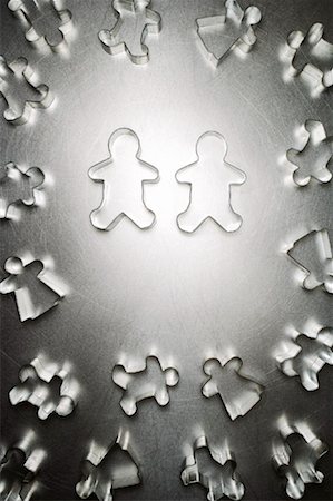 Two Gingerbread Men Cookie Cutters, Surrounded by Others Stock Photo - Rights-Managed, Code: 700-01955412