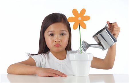 fake flowers - Girl Watering Flower Stock Photo - Rights-Managed, Code: 700-02010277