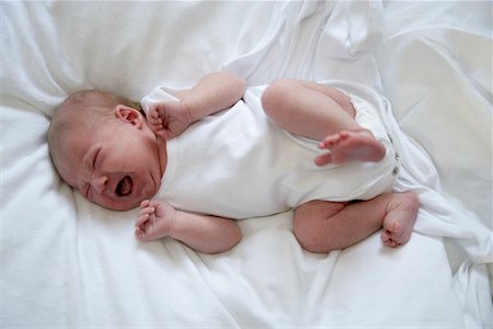 frustrated child white background - Baby in Bed, Crying Stock Photo - Rights-Managed, Code: 700-02010333