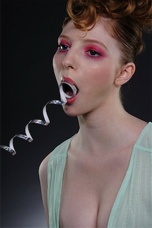 simsearch:700-02371432,k - Portrait of Woman with Ribbon in Mouth Foto de stock - Direito Controlado, Número: 700-02010640