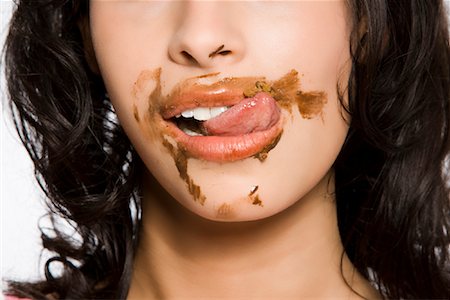 eat mouth closeup - Femme au chocolat sur son visage Photographie de stock - Rights-Managed, Code: 700-02038098