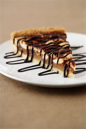 pastel de pacana - Slice of Pecan Pie Foto de stock - Con derechos protegidos, Código: 700-02046205