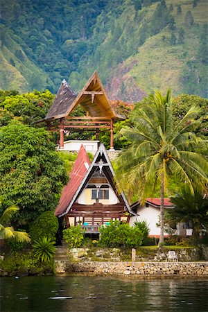 Traditional Buildings on Lake Shore, Lake Toba, Sumatra, Indonesia Stock Photo - Rights-Managed, Code: 700-02046531