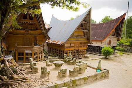 simsearch:700-03665775,k - Stone Chairs and Table by Traditional Buildings, Lake Toba, Sumatra, Indonesia Stock Photo - Rights-Managed, Code: 700-02046533