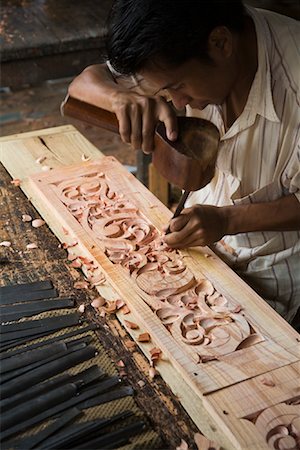 Wood Carver at Work, Pandai Sikat, Sumatra, Indonesia Stock Photo - Rights-Managed, Code: 700-02046597