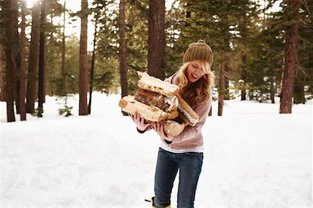 people gathering wood in the snow - Woman Carrying Firewood Stock Photo - Rights-Managed, Code: 700-02046921