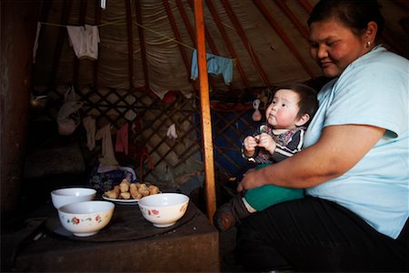 Mother and Child in Yurt, Mongolia Stock Photo - Rights-Managed, Code: 700-02046979