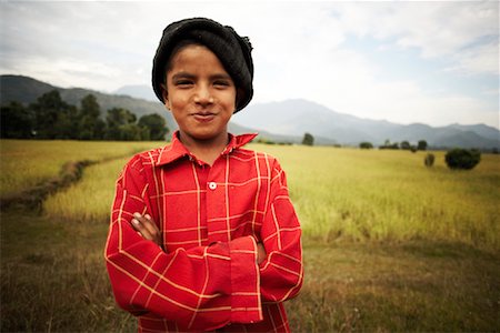 pokhara - Portrait of Boy in Field, Pokhara, Nepal Foto de stock - Con derechos protegidos, Código: 700-02047007