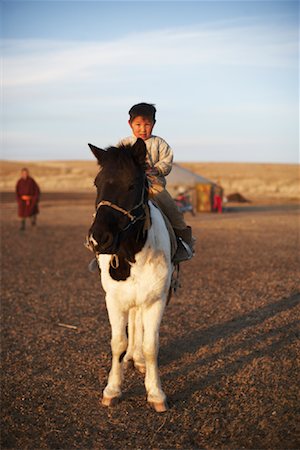 Portrait of Little Boy on Horseback, Mongolia Stock Photo - Rights-Managed, Code: 700-02047054