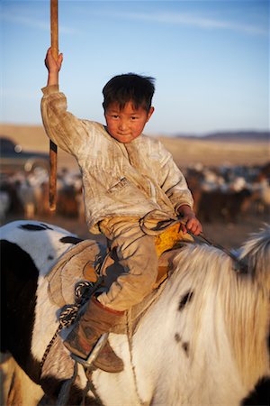 simsearch:841-05796497,k - Portrait of Little Boy on Horseback, Mongolia Fotografie stock - Rights-Managed, Codice: 700-02047055