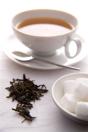 Tea Leaves with Tea Cup and Sugar Foto de stock - Direito Controlado, Número: 700-02055595