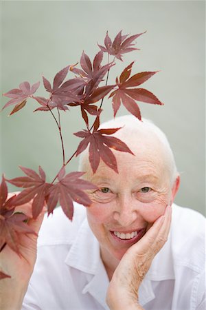 Portrait of Woman Holding Red Maple Branch Stock Photo - Rights-Managed, Code: 700-02071308