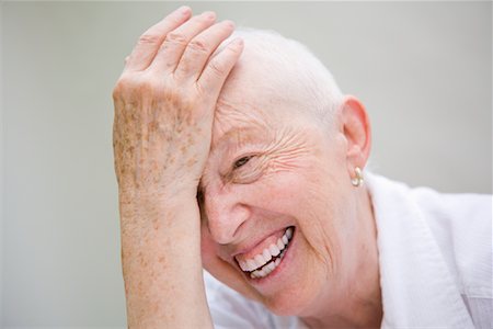 Portrait of Mature Woman Laughing Foto de stock - Con derechos protegidos, Código: 700-02071310