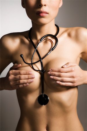 salute delle donne - Nude Woman Wearing Stethoscope Fotografie stock - Rights-Managed, Codice: 700-02071376