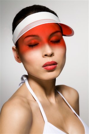 sun visor hat - Portrait of Woman Wearing Sun Visor Stock Photo - Rights-Managed, Code: 700-02071370