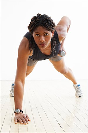 simsearch:700-02071519,k - Woman Doing Push-Ups with Weights Stock Photo - Rights-Managed, Code: 700-02071491