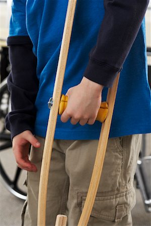 Close-up of Boy's Hand Holding Crutch Stock Photo - Rights-Managed, Code: 700-02071747
