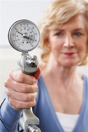endurance test - Woman Holding Gauge to Measure Strength Stock Photo - Rights-Managed, Code: 700-02071763