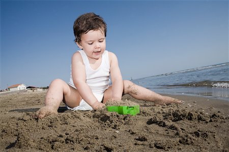 sitting feet in water - Little Boy on the Beach, Tor San Lorenzo, Ardea, Lazio, Italy Stock Photo - Rights-Managed, Code: 700-02080048