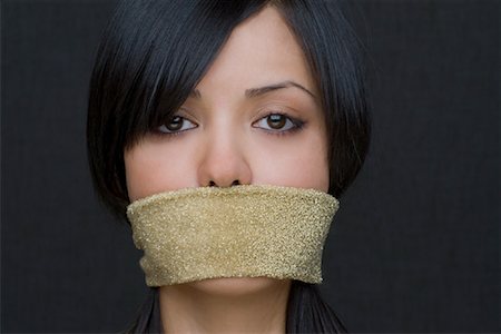 Portrait of Woman With Band Covering Her Mouth Foto de stock - Con derechos protegidos, Código: 700-02080496