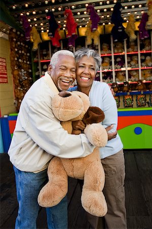 people playing carnival - Couple Hugging and Holding Stuffed Toy, Santa Monica Pier Amusement Park, California, USA Stock Photo - Rights-Managed, Code: 700-02125382