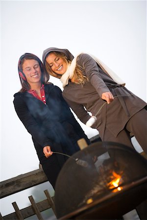 people adult fireplace fun - Two Women Roasting Marshmallows Over Fire Stock Photo - Rights-Managed, Code: 700-02125539