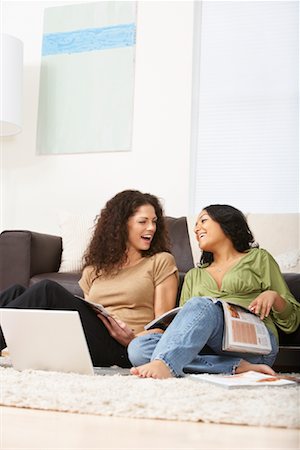 Women Reading Magazines, Hanging Out in Living Room Stock Photo - Rights-Managed, Code: 700-02129026