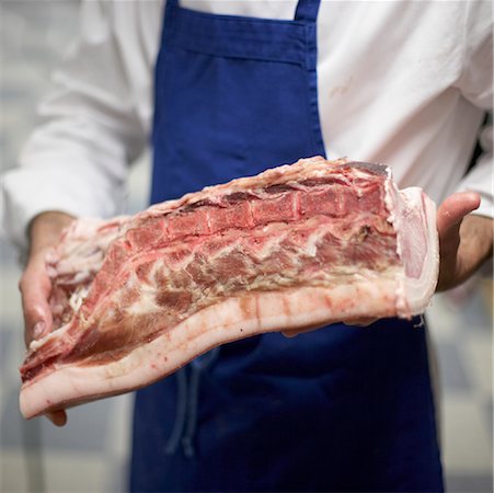 Organic Butcher Holding Meat Stock Photo - Rights-Managed, Code: 700-02129061