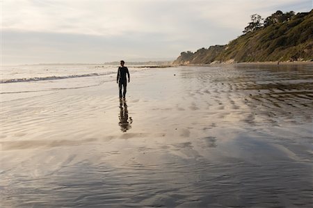 simsearch:400-03914202,k - Man Walking on Arroyo Burro Beach Santa Barbara, California, USA Stock Photo - Rights-Managed, Code: 700-02121087