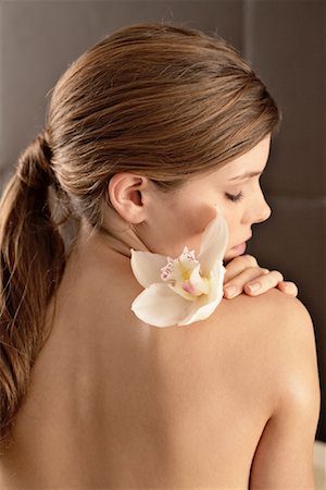 spa young - Rear View of Woman With Flower on Her Shoulder Stock Photo - Rights-Managed, Code: 700-02121381