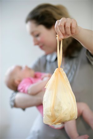 foul odor - Woman with Baby and Diaper Bag Stock Photo - Rights-Managed, Code: 700-02130444