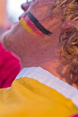 Gros plan des couleurs allemandes peinte sur le visage des Sports Fan, Euro 2008, Salzbourg, Autriche Photographie de stock - Rights-Managed, Code: 700-02130794