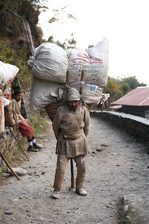 Homme transportant de lourdes charges, Everest Base Camp, Lukla, Népal Photographie de stock - Rights-Managed, Code: 700-02156739