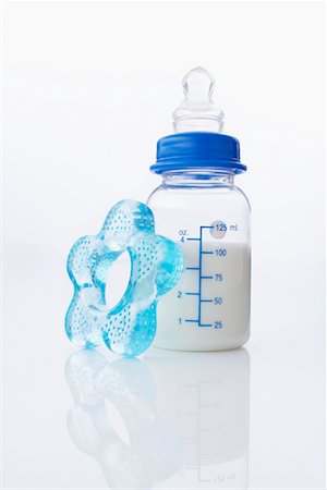 Baby Bottle and Teething Ring Stock Photo - Rights-Managed, Code: 700-02159107