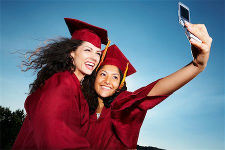 Graduates Taking Self Portrait Fotografie stock - Rights-Managed, Codice: 700-02175773