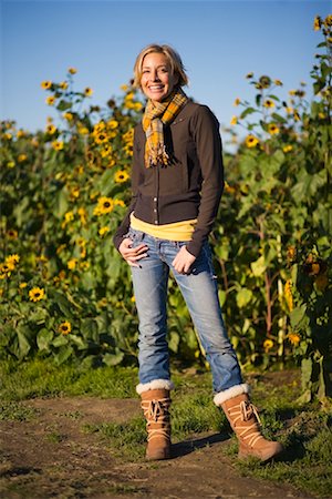 Woman Standing by Field of Sunflowers Stock Photo - Rights-Managed, Code: 700-02176020