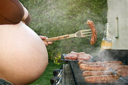 Pregnant Woman Cooking on Barbeque Stock Photo - Rights-Managed, Code: 700-02176512