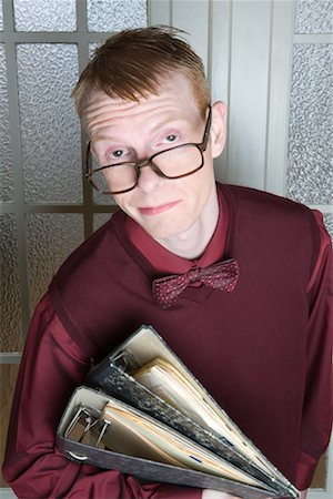 student portrait teacher not smiling - Portrait of Man with Binders Stock Photo - Rights-Managed, Code: 700-02198253