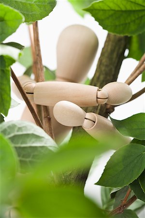 Wooden Mannequin Hugging Tree Branch Stock Photo - Rights-Managed, Code: 700-02199849