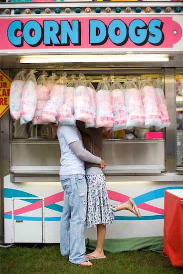 Girl and Boy Hugging at Carnival Stock Photo - Premium Rights-Managed, Artist: Ty Milford, Image code: 700-02200329