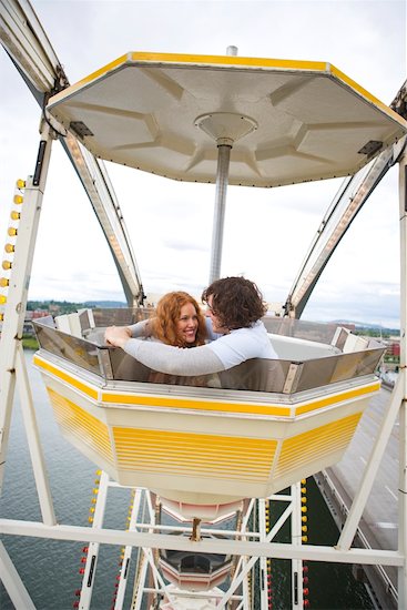 Couple Hugging on Ferris Wheel Stock Photo - Premium Rights-Managed, Artist: Ty Milford, Image code: 700-02200332