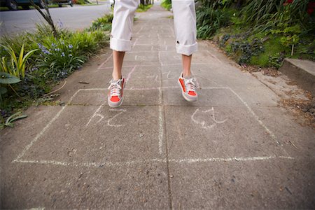 sneaker leg - Woman Playing Hopscotch Stock Photo - Rights-Managed, Code: 700-02200344