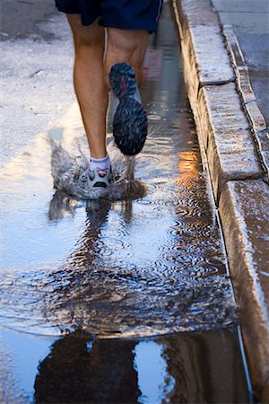 Man Running on Wet Road, Providence, Rhode Island, USA Stock Photo - Rights-Managed, Code: 700-02200347