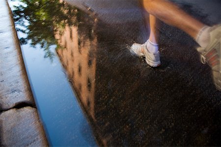 Man Running Through Puddle Stock Photo - Rights-Managed, Code: 700-02201542