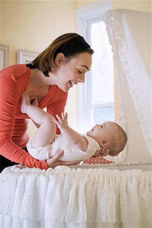 Mother with Baby in Bassinet Stock Photo - Rights-Managed, Code: 700-02216099