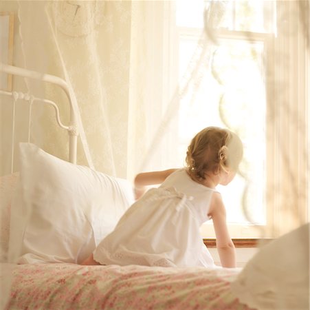 feminine young girl - Little Girl in Bedroom, Looking Out Window Stock Photo - Rights-Managed, Code: 700-02217413