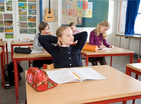 photo of class with misbehaving kids - Girl with Schoolwork in Classroom Foto de stock - Con derechos protegidos, Código: 700-02217465