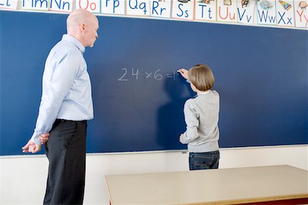 Teacher with Student in Classroom Stock Photo - Rights-Managed, Code: 700-02217476