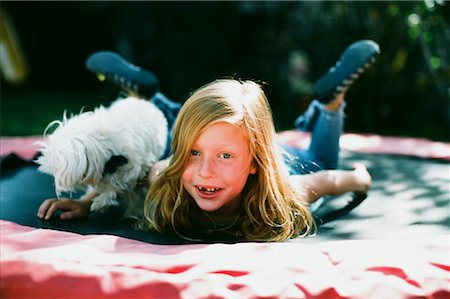 red head animals - Girl with Dog on Trampoline, Costa Mesa, California, USA Stock Photo - Rights-Managed, Code: 700-02217528